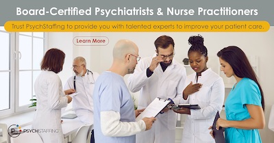 A room full of doctors and medical staff talking and reading off a clipboard.