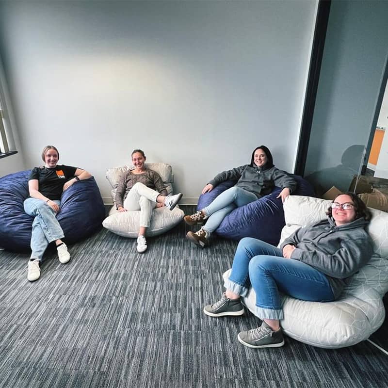 A group of FSMers relaxes in beanbag chairs in the Think Tank room.